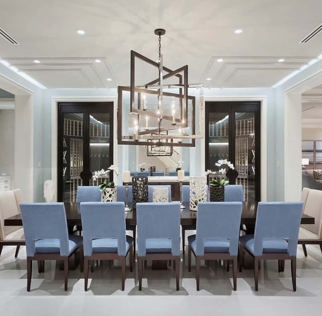 modern blue dining room with abstract light fixture